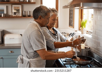 Cooking food, help and old couple in kitchen with smile, meal prep and frying at stove together. Love, senior woman helping elderly man prepare lunch in pan, retirement and dinner time in modern home - Powered by Shutterstock