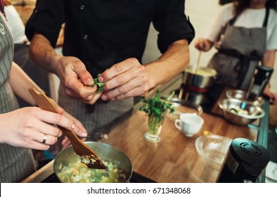 Cooking Food Together. Hands Of A Man In The Kitchen Close-up With Greens. Vegan, Vegetarian, Vegetarian Dinner.