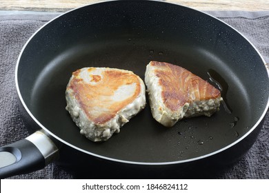 Cooking Fresh Ahi Tuna Fillet Steaks With Olive Oil In Frying Pan