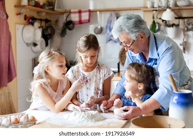 Cooking At Home. Family Having Fun Together. Grandmother And Kids Baking Bread, Making Easter Cake And Holiday Dinner In Cozy Kitchen. Children Chef. Lifestyle Authentic Moments. Candid True Emotions