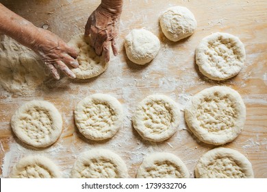 Cooking At Home, Old Woman's Hands Getting The Bread Ready To Be Baked 