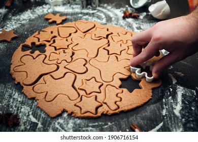 Cooking homemade gingerbread cookies. Traditional homemade Christmas pastries. Making homemade gingerbread cookies. Festive atmosphere, home cooking.