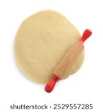 Cooking homemade pie. Raw dough and rolling pin on white background, top view