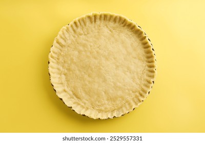 Cooking homemade pie. Raw dough on yellow background, top view - Powered by Shutterstock