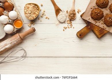 Cooking Ingredients For Oatmeal Cookies Background. Eggs, Flour, Spices And Kitchen Utensils On White Wood Table. Recipe Or Baking Classes Mockup, Pastry Making Concept, Top View, Copy Space