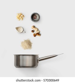 Cooking Italian Food, Risotto With Wild Mushrooms, Isolated On White Background. Rice, Fungus, Sauce, Parmesan And Other Ingredients Over Saucepan