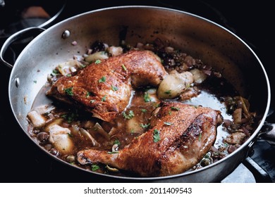 Cooking Italian Split Chicken Leg Piccata In Large Pan On Kitchen Stove