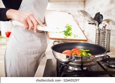 cooking in kitchen woman
