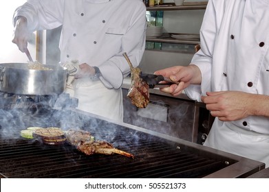 Cooking lamb chops.
Chef imparting the perfect doneness for meat
 - Powered by Shutterstock