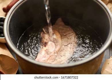 Cooking Meat Broth. Add Water To The Meat Pan.