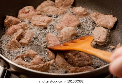 Cooking Meat In A Frying Pan