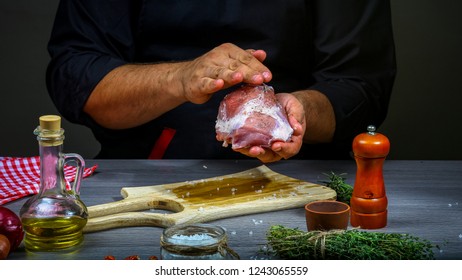 Cooking meat steak, vegetables and spices with by chef hands on wooden background. cooking recipe. - Shutterstock ID 1243065559