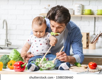 Cooking Men. Funny Dad Preparing Lunch With Baby Son, Fooling With Salad Moustache, Free Space