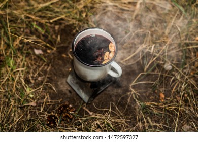 Cooking Mulled Wine In Nature On A Tourist Stove