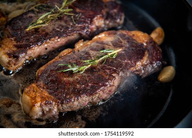 Cooking New York Strip Steak On Skillet Pan