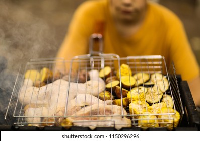 cooking on chargrill chicken barbeque and vegetables mix corn potato and eggplants cut on grate