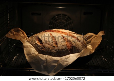 Cooking organic bread at home due to quarantine. Breads in slices while baking in the oven and after cooking
