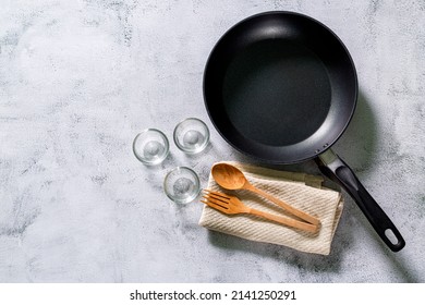 Cooking Pan,Clean Frying Pan On The Rustic Background. Selective Focus. Shot From Above,Cast Iron Pan And Spices On Black Metal Culinary Background