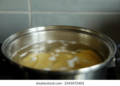 Cooking pasta in boiling water is an essential culinary technique for creating a delicious dish - Powered by Shutterstock