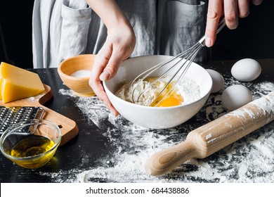 cooking pasta by chef in kitchen on dark background Stock Photo