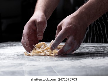 Cooking pasta spaghetti dough with flour on a dark black background with spatial area. Food banner, large resolution. - Powered by Shutterstock