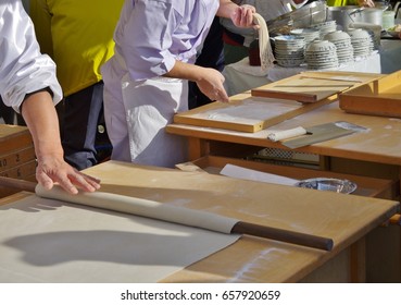 Cooking person making Japanese noodles - Shutterstock ID 657920659