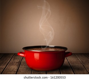 Cooking Pot On Old Wooden Table