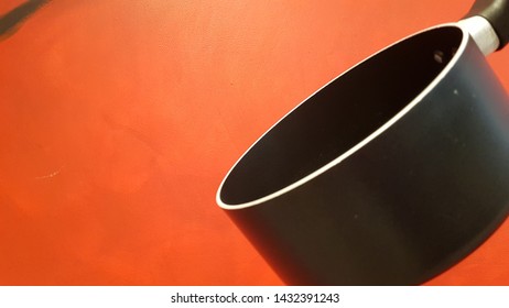 Cooking pot and red orange Background