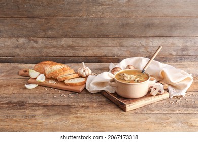 Cooking Pot With Tasty Beef Barley Soup On Table