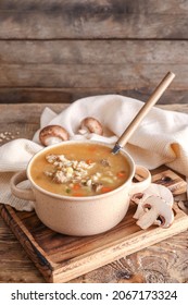 Cooking Pot With Tasty Beef Barley Soup On Table