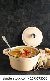 Cooking Pot With Tasty Beef Barley Soup On Table