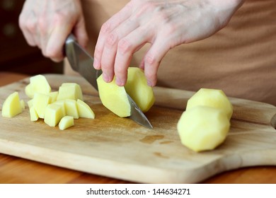 Cooking Potato. Cutting.