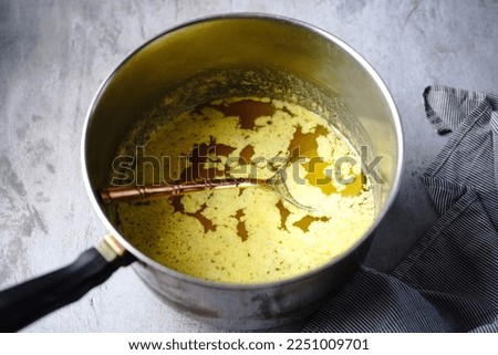 Cooking process of ghee | How to make clarified butter at home, selective focus