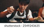 Cooking, ramen and bowl with Japanese man in restaurant for fine dining course, dinner and learning recipe. Ingredients, culture and food with asian people in class for diet, menu and meal prep