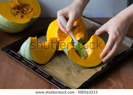 Cooking roasted spicy pumpkin on oven tray