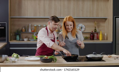 Cooking Show Hosts Chefs, Male And Female, Cooking Meat. Morning TV Cooking Programme