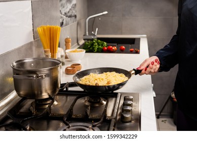 Cooking Spaghetti Concept. Pasta In The Pan. Cooking Fresco Pasta. Italian Cuisine, Tomato Sauce For Pasta, Healthy Food Making, Detailed View Steam In The Kitchen. Flipping Pasta In The Air