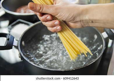 Cooking Spaghetti In A Pot With Boiling Water