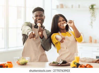 Cooking Together in a Bright Kitchen While Having Fun With Food and Utensils