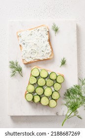 Cooking Traditional English Tea Sandwiches With Cucumber, Cream Cheese, Dill For Breakfast On White Marble Board. View From Above. Vertical Format