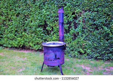 Cooking Traditional Hungarian Goulash In Cauldron 