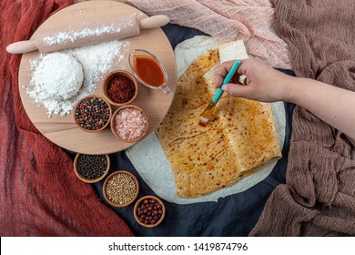 Cooking traditional Turkish Yufka (  pastries, pancake) on the stove. Closeup on the bake. Handmade pastries concept. - Shutterstock ID 1419874796