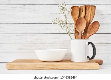 Cooking utensils and cutting board on white table. Kitchen utensils background - Powered by Shutterstock