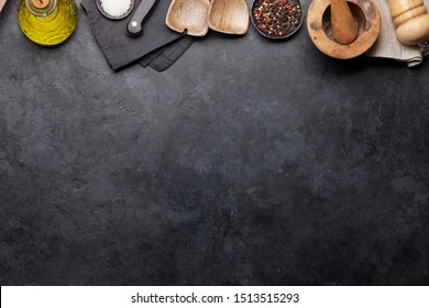 Cooking utensils and spices on stone kitchen table. Top view with copy space for your recipe - Shutterstock ID 1513515293