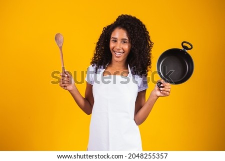 Cooking utensils. young woman banging pans