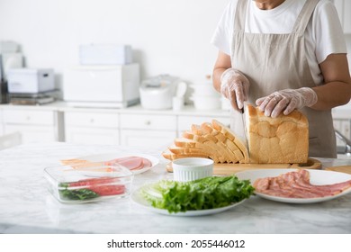 Cooking with vinyl gloves, preventive measures for COVID-19 - Powered by Shutterstock