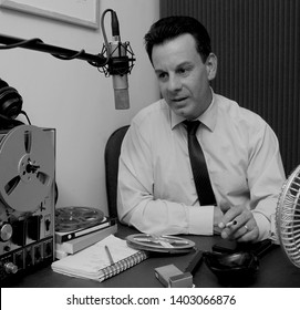 A Cool 1950's 60's DJ On Talk Back Radio Holds Cigarette