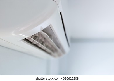 cool air conditioner system on white wall room - Shutterstock ID 328623209