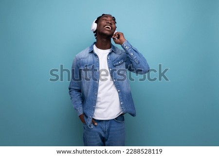 Similar – Young happy black man is listening to music