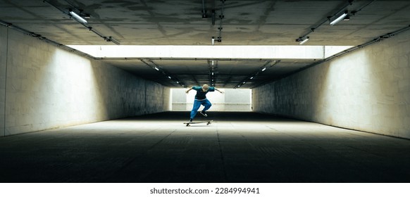 Cool Asian guy skating on longboard skate at park on summer holiday vacation. Stylish young man enjoy and fun urban active lifestyle practicing outdoor sport skateboarding on city street at sunset. - Powered by Shutterstock